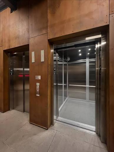 A complete passenger lift specification covers standard dimensions, mechanical drive systems, structural shaft requirements, and core safety standards.